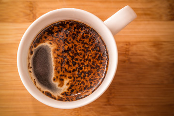 Coffee cup on a wooden background - enhanced colors