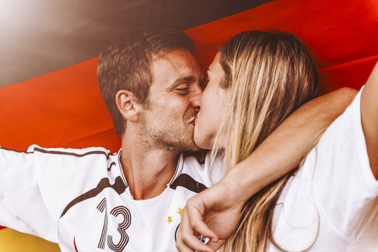 Supporters from Germany kissing at Stadium