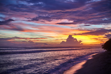 Naklejka na ściany i meble amazing colorful sunset on the sea