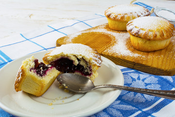 Sweet small pie on the white plate, close up