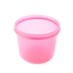 Pink plastic beaker cup isolated over the white background