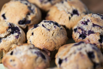 Homemade wholegrain muffins with blueberries on a plate. Selective focus