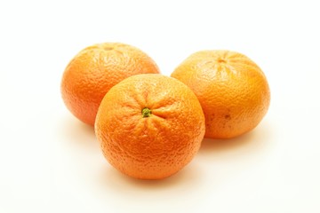 Three tangerines in close-up