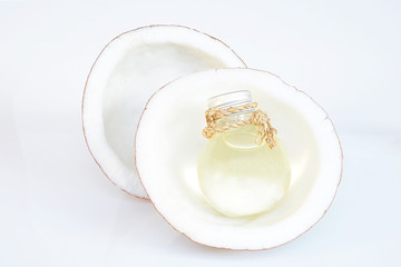 Fototapeta na wymiar coconut oil and fresh coconuts isolated on white 