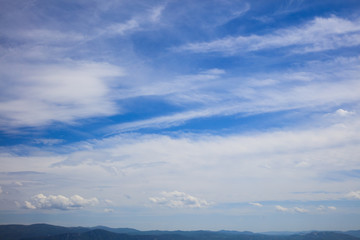 Fototapeta na wymiar Endless landscape under blue cloudy sky