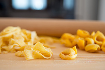 detail of Italian fresh pasta: tortellini and tagliatelle