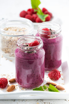 healthy raspberry smoothie with oatmeal, vertical, closeup