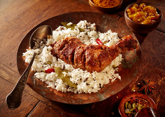 Hearty serving of herbed rice and spicy chicken