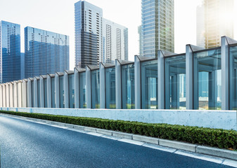 Obraz premium highway railings,highrise buildings