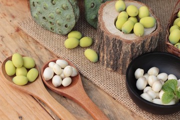 Lotus seeds in nature on wood background.