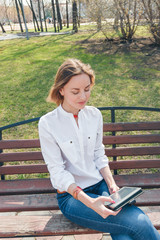 smiling girl touching tablet screen