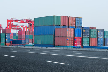 Fototapeta premium cargo containers and cranes at port