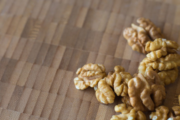 Fototapeta premium Walnut kernels and whole walnuts