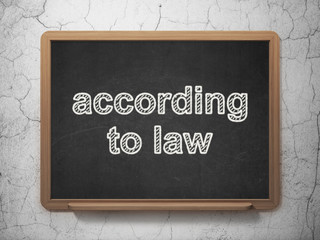 Law concept: According To Law on chalkboard background