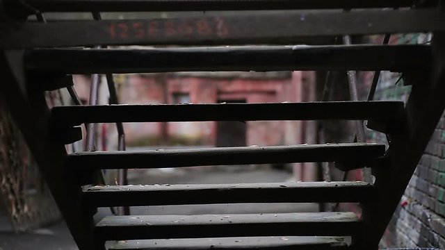 Disobedient teenager wandering in deserted old street, student skipping classes
