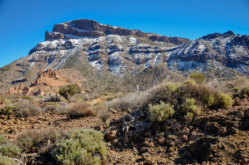 snow covered mount Guajara on the edge of Teide volcano caldera 
Roques de Garcia, Teide National park, Tenerife, Canary islands, Spain