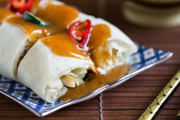 Soft Spring rolls with gravy sauce on top