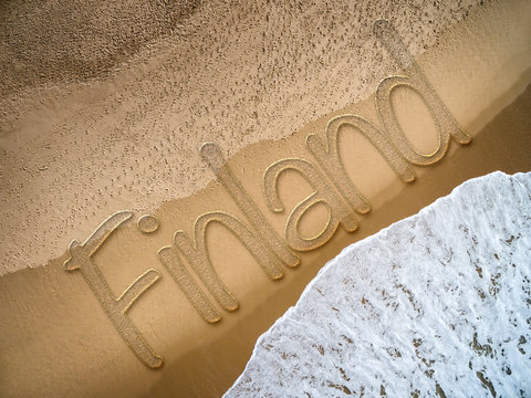 Finland written on the beach