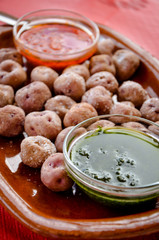 Canarian wrinkled potatoes (papas arrugadas) served with red mojo (traditional sauce) and green mojo
Tenerife, Canary Islands, Spain
