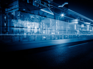 Obraz premium light trails against buildings background