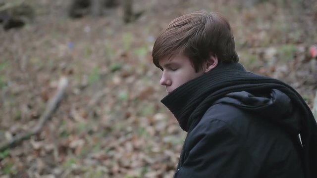 Lonely teenage emo guy having sad thoughts, depressive emotions after breakup