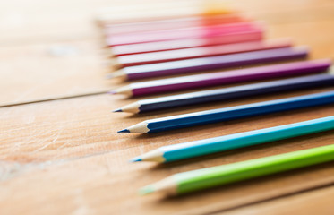 Fototapeta premium close up of crayons or color pencils on wood