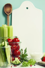 Assorted fresh vegetables with dip and White ceramic serving boa