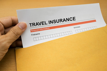 travel Insurance application form on brown envelope