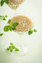 Fresh banana cocktail with mint on the wooden background