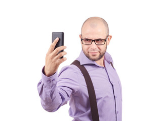 Happy bald young man taking a selfie photo.