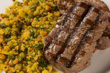 Fillet mignon grilled on plate with crumbs and bacon