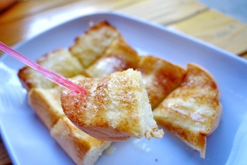 Toasted bread topped with condensed milk