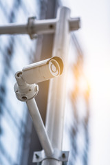 security camera in front of the office building,blue toned image.