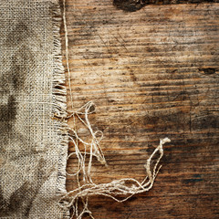 Burlap textile on wooden background