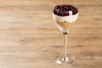 pannacota dessert covered in raspberry sauce and fresh raspberri