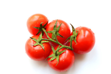 Bunch of red tasty fresh tomatos on the white background. 