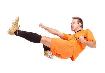 Foto op Canvas Soccer football player kicking isolated on a white background © milkovasa