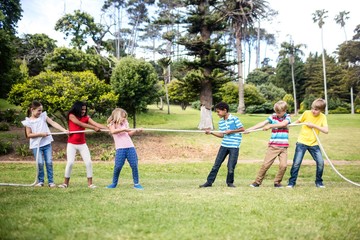 Children pulling a rope in tug of war © WavebreakMediaMicro