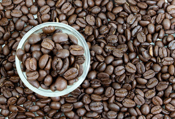 short glass with arabica coffee beans