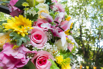 beautiful color artificial flower and outdoor bokeh blur backgro