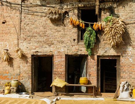 House with corn cobs hanged to dry in Bungamati, Nepal