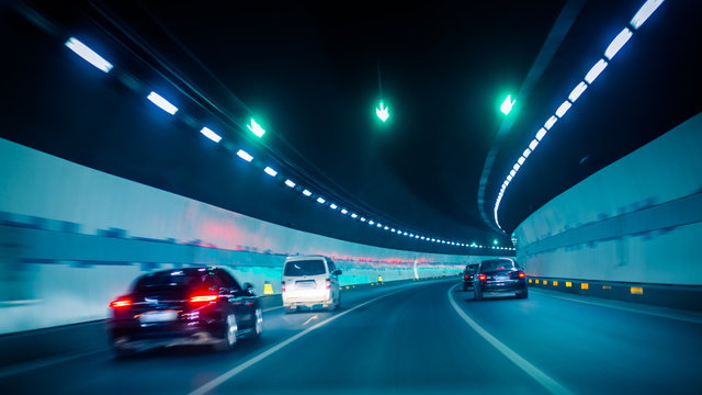 Fototapeta car driving through tunnel