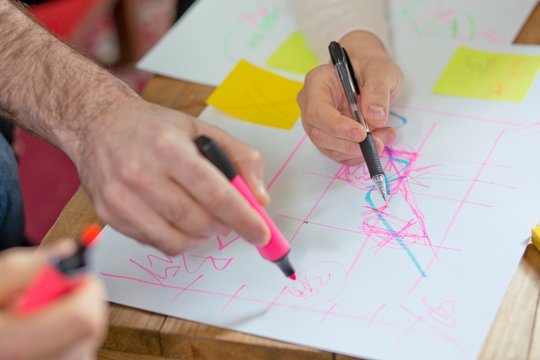 People writing on paper