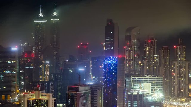 Scenic aerial view of a big modern city at night timelapse. Business bay, Dubai, United Arab Emirates.
