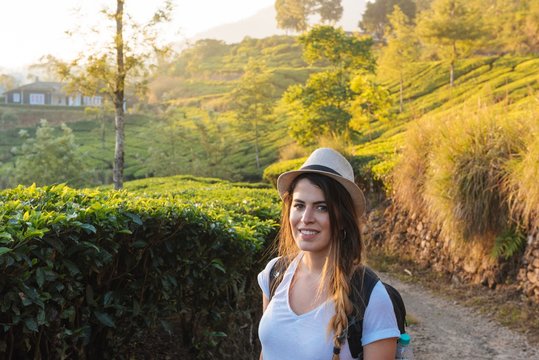 Portrait of young woman at tea plantations near Munnar, Kerala, India