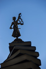 Lady Justice - Temida - Themis, Lady of Justice on a background of blue sky 
