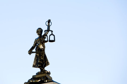 Lady Justice - Temida - Themis,  silhouette on a blue background 