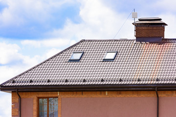house with a gable roof window