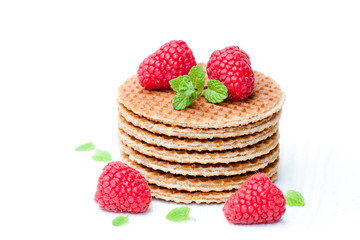 Stack  of Dutch caramel waffles with fresh raspberry and cup of