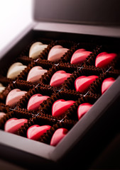 Pralines heart shaped gradually colored in luxury brown box package